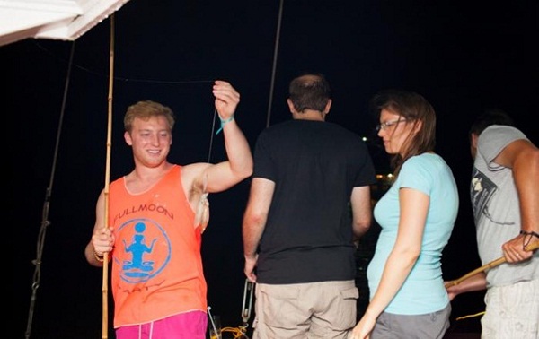 Visitors are very interested in Night squid fishing on Halong Bay boats