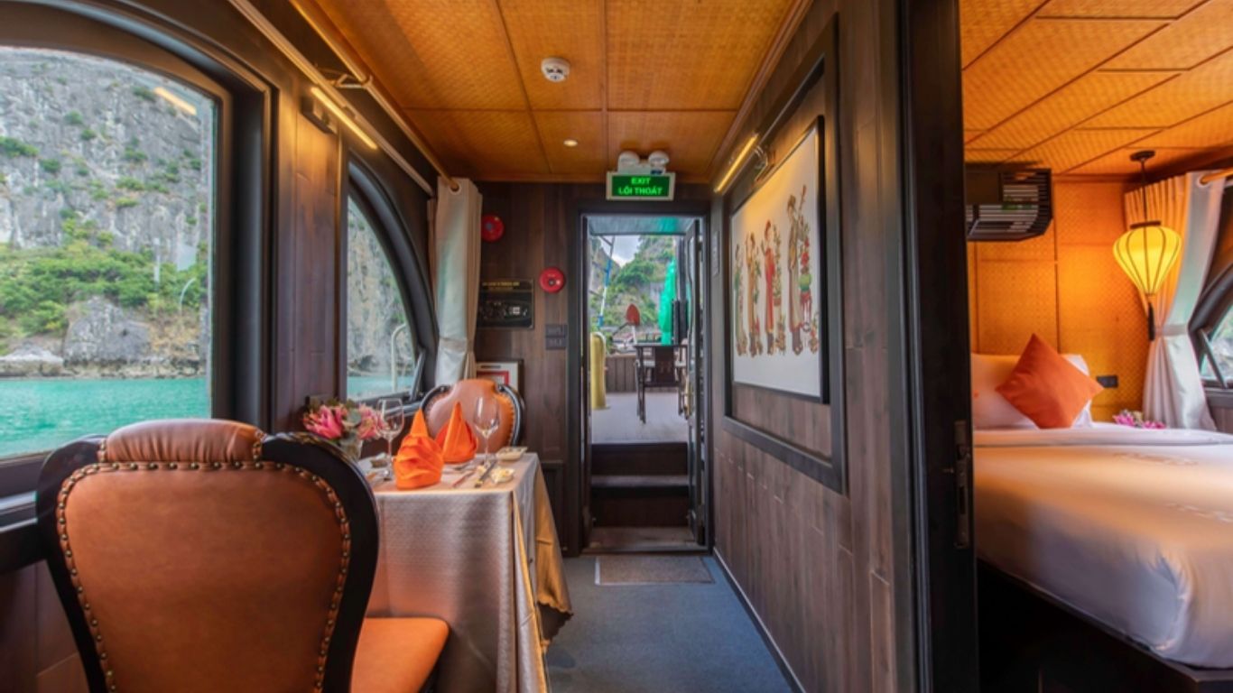 Interior view of the cabin and dining table inside the L'Amour Junk Cruise