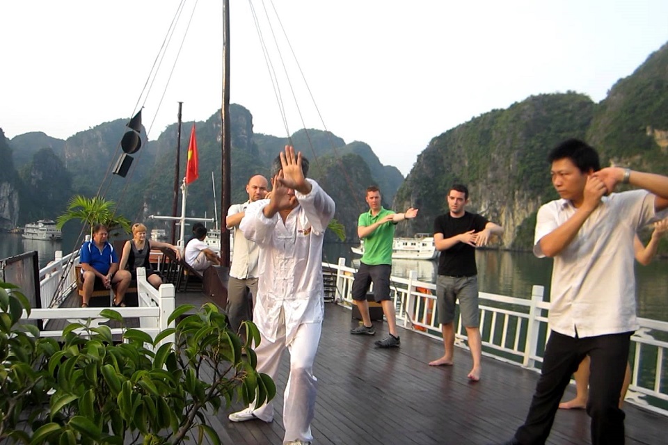 Tai chi exercise in Halong bay